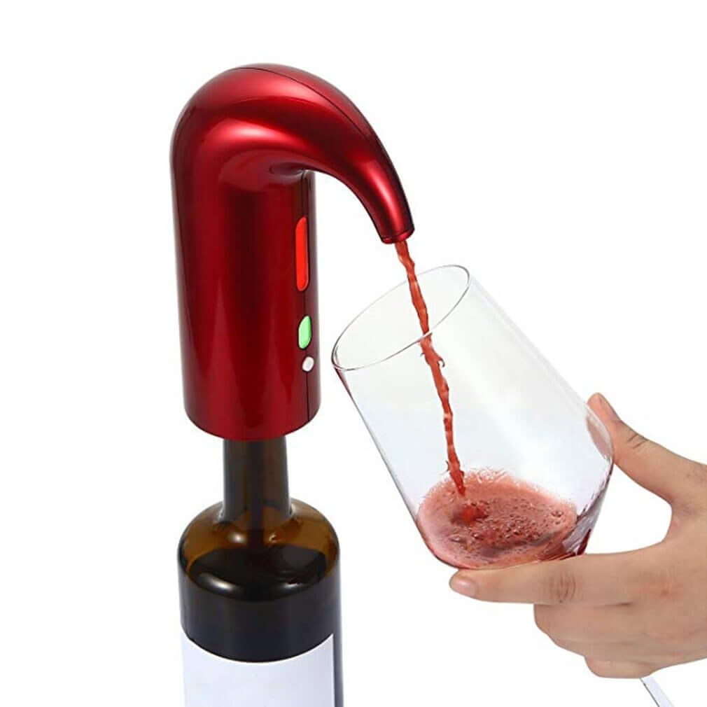 Red electric wine opener being used to pour red wine into a glass.