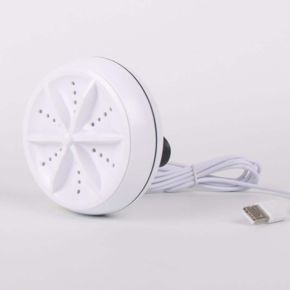 White 2-in-1 mini ultrasonic washer and cleaner with a USB cable on a light gray background