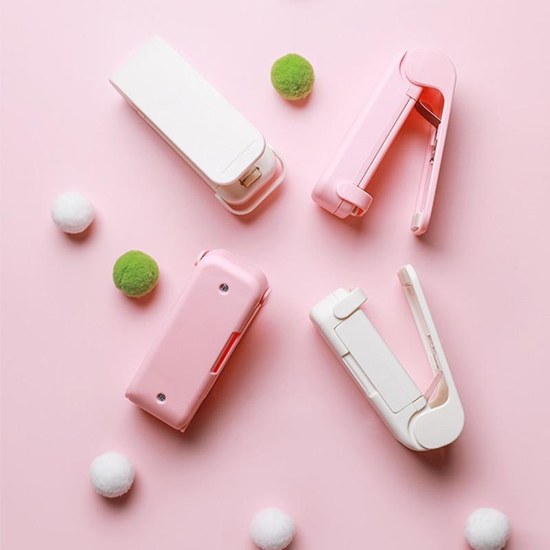 Pink and white bag heater on a pink background with decorative items.