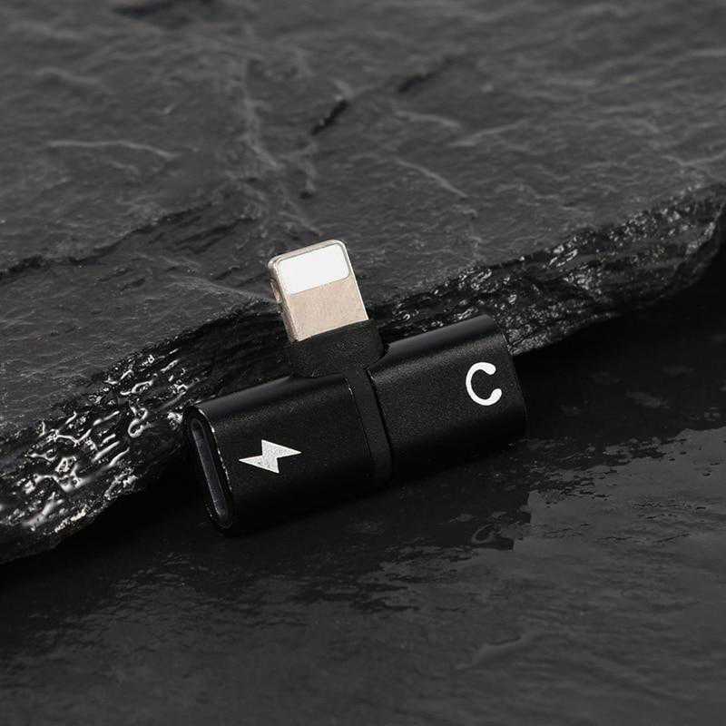 Compact 2-in-1 Lightning to headphone jack and charger adapter in black