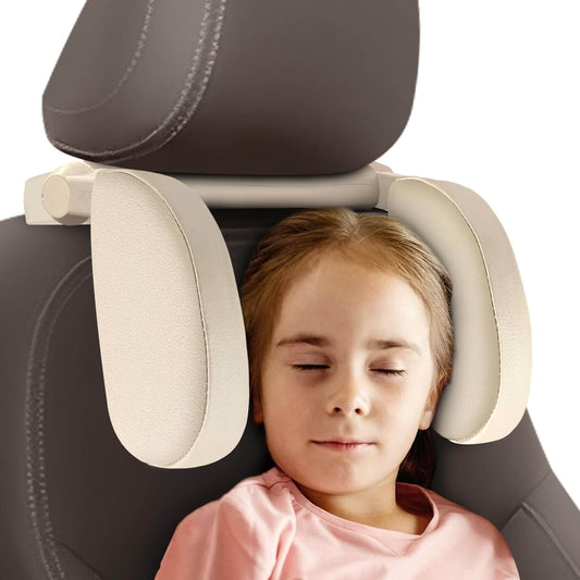 Child using a car headrest pillow with a neutral background