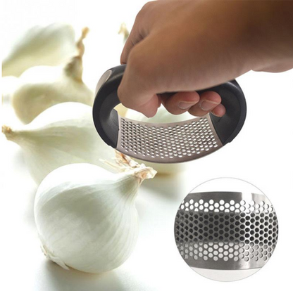 Stainless steel garlic press with built-in cleaner and dishwasher safe design