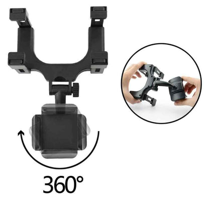 Black phone mount attached to car rearview mirror close-up view